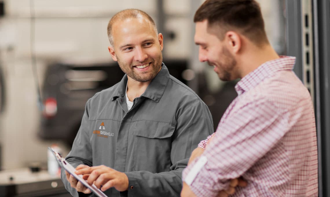 An Action Overhead garage door repair technician