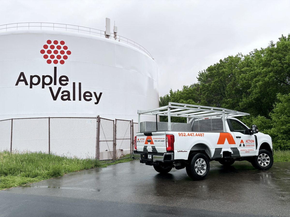 Action Overhead Truck servicing the Apple Valley area, with the Apple Valley water tower in view